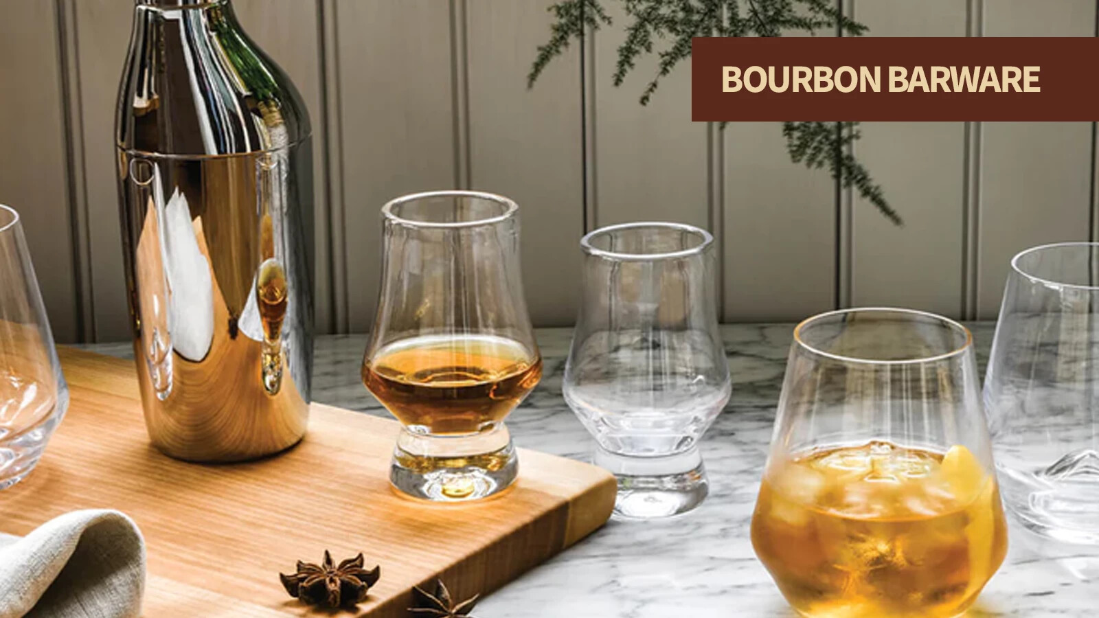 Bourbon barware including tasting glasses, decanters, ice molds, and whiskey accessories.