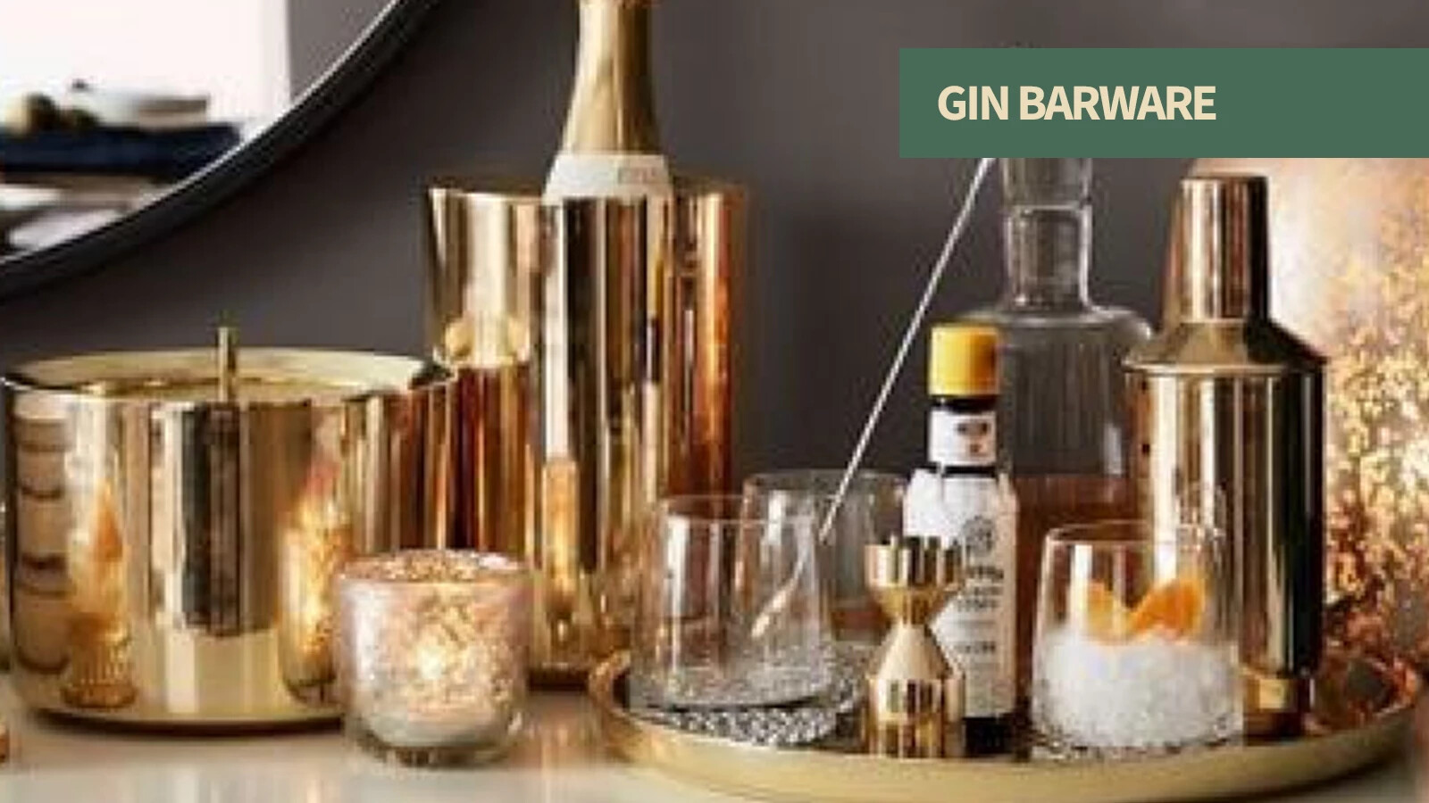 Gin barware including Martini glasses, mixing glasses, bar spoons, strainers, and garnish tools.