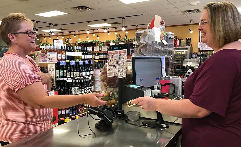 Customer and cashier sharing a moment